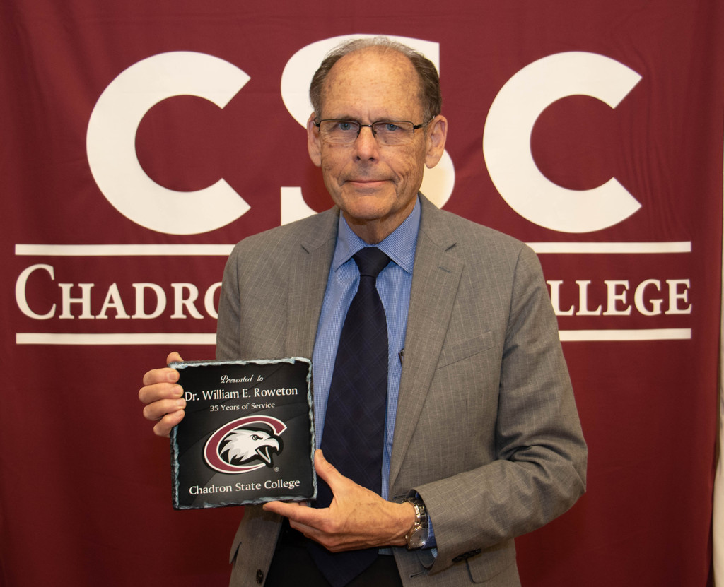 Chadron State College employee Dr. William Roweton, 35 years of service, poses at the annual CSC recognition luncheon.