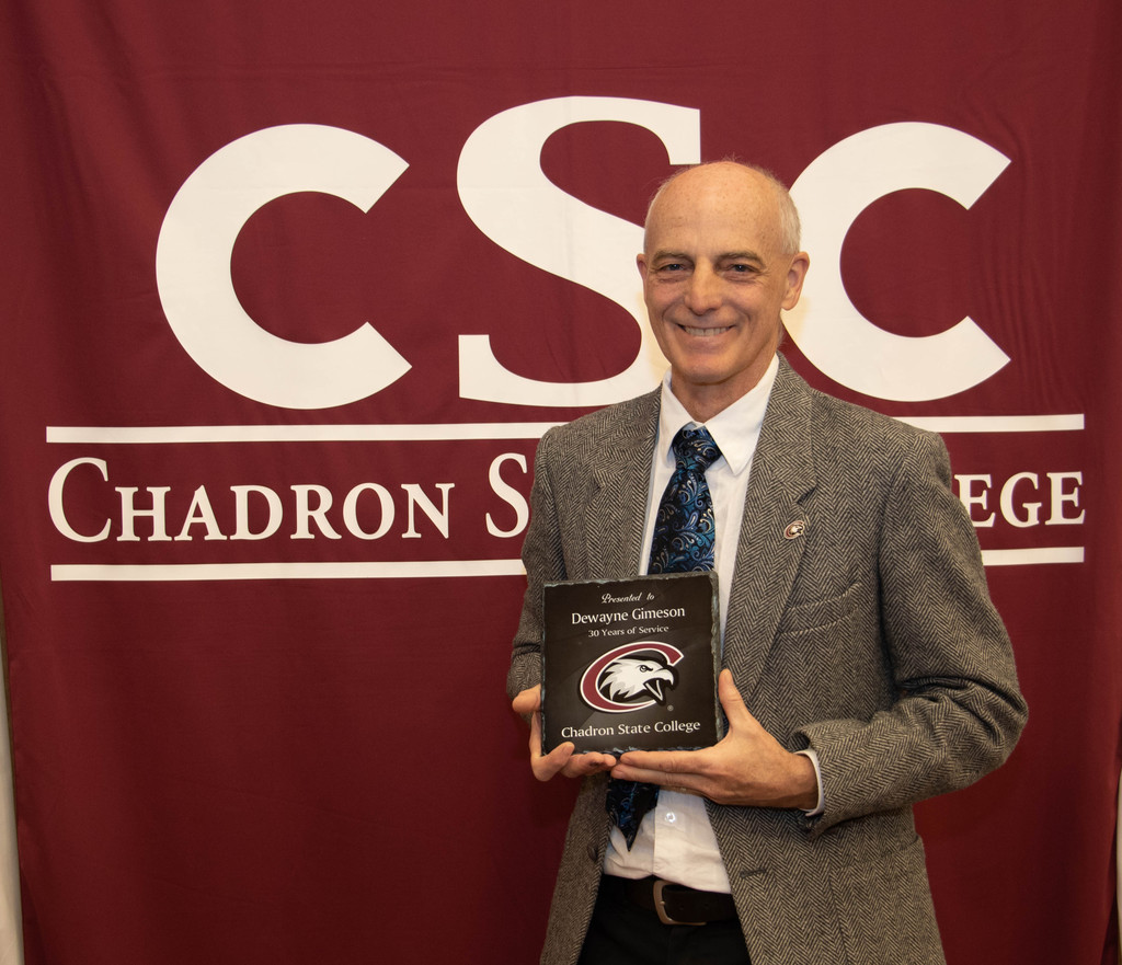 Chadron State College employee Dewayne Gimeson, 30 years of service, poses at the annual CSC recognition luncheon.