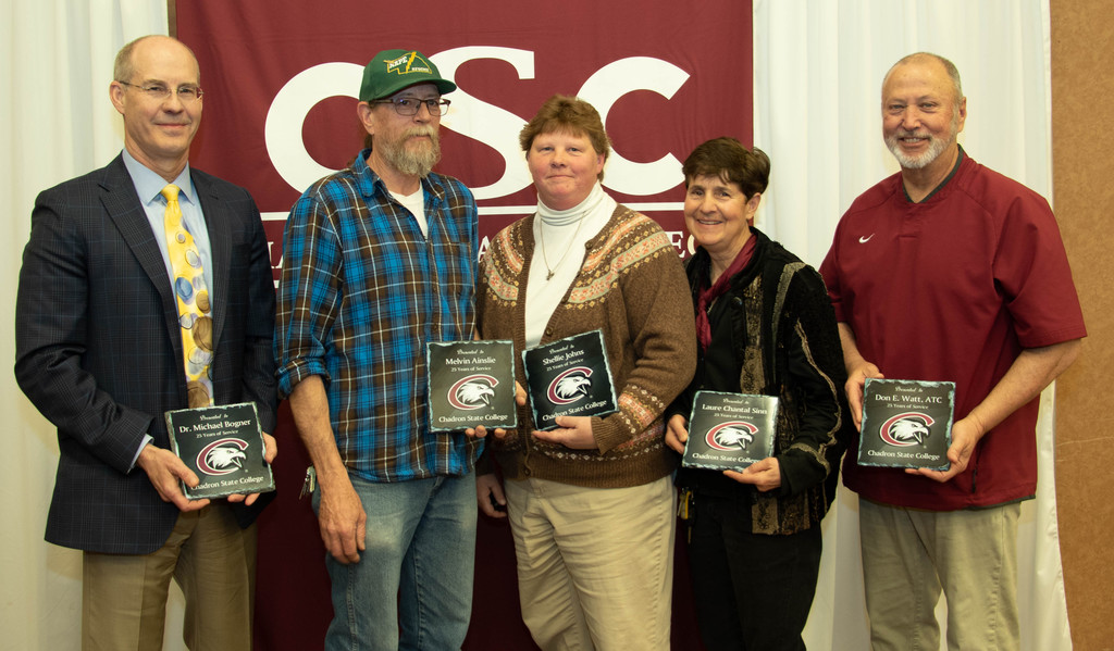 Chadron State College employees with 25 years of service pose at the annual CSC recognition luncheon April 30, 2019, in the CSC Student Center. From left, Mike Bogner, Mel Ainslie, Shellie Johns, Laure Sinn and Don Watt.