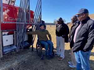 National Organizing Committee members of the Joint International Grassland Congress and International Rangeland Congress from Kenya listen to Rob Ziegler with the Gudmundsen Sandhills Laboratory,