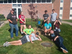 Chadron State College students pose for a photo outside of Kent Hall after completing campus beatifications with Project Strive/TRiO