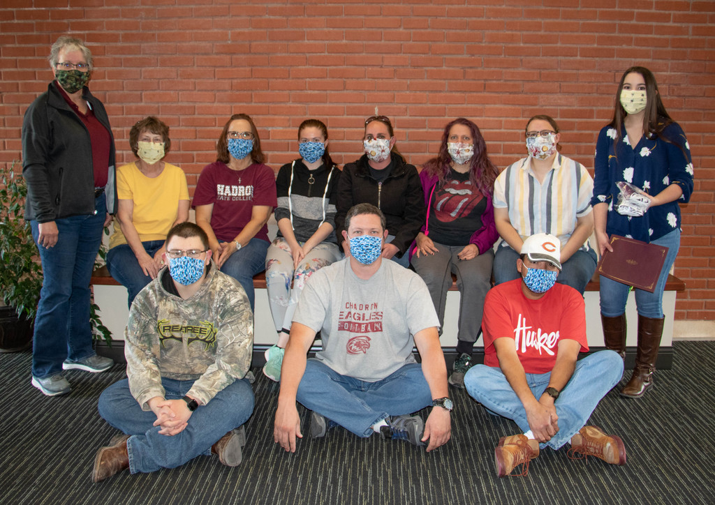 Dr. Joyce Hardy and Katie Diehl pose with custodial staff members in Sparks Hall