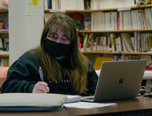 Chadron State College student Rylie Cole takes notes during one of the virtual sessions