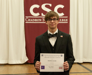 One high school student poses with his award as CSC hosts History Day