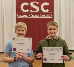 Two high school students pose with their awards as CSC hosts History Day