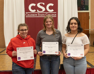 Three high school students pose with their awards as CSC hosts national history day.