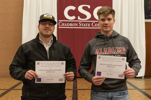 Two high school students pose with their awards as CSC hosts national history day.