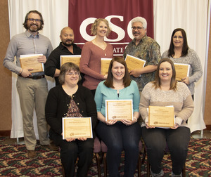 Eight CSC Faculty and Staff members pose with their awards