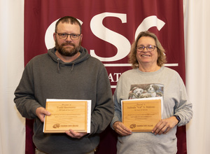 Todd Baumann and Velinda Malone pose with their awards