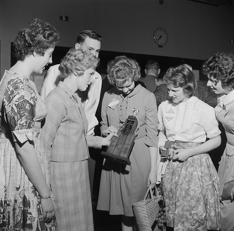 Group of students holding a trophy