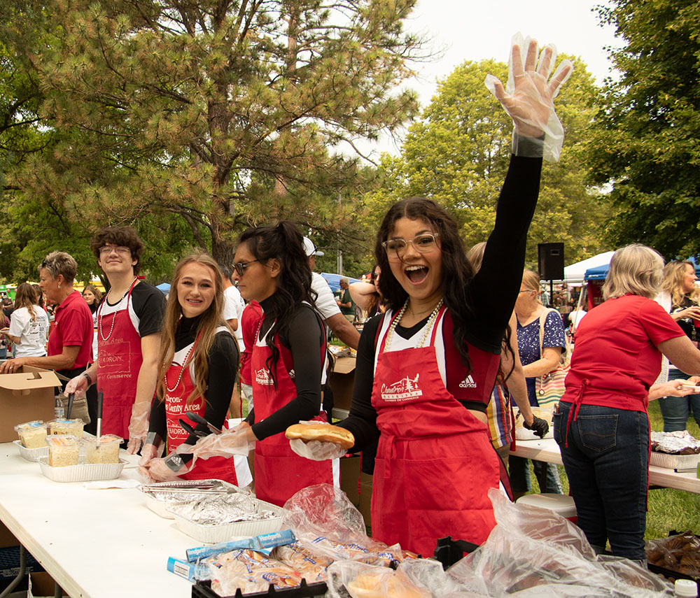 Cheerleaders serving a meal
