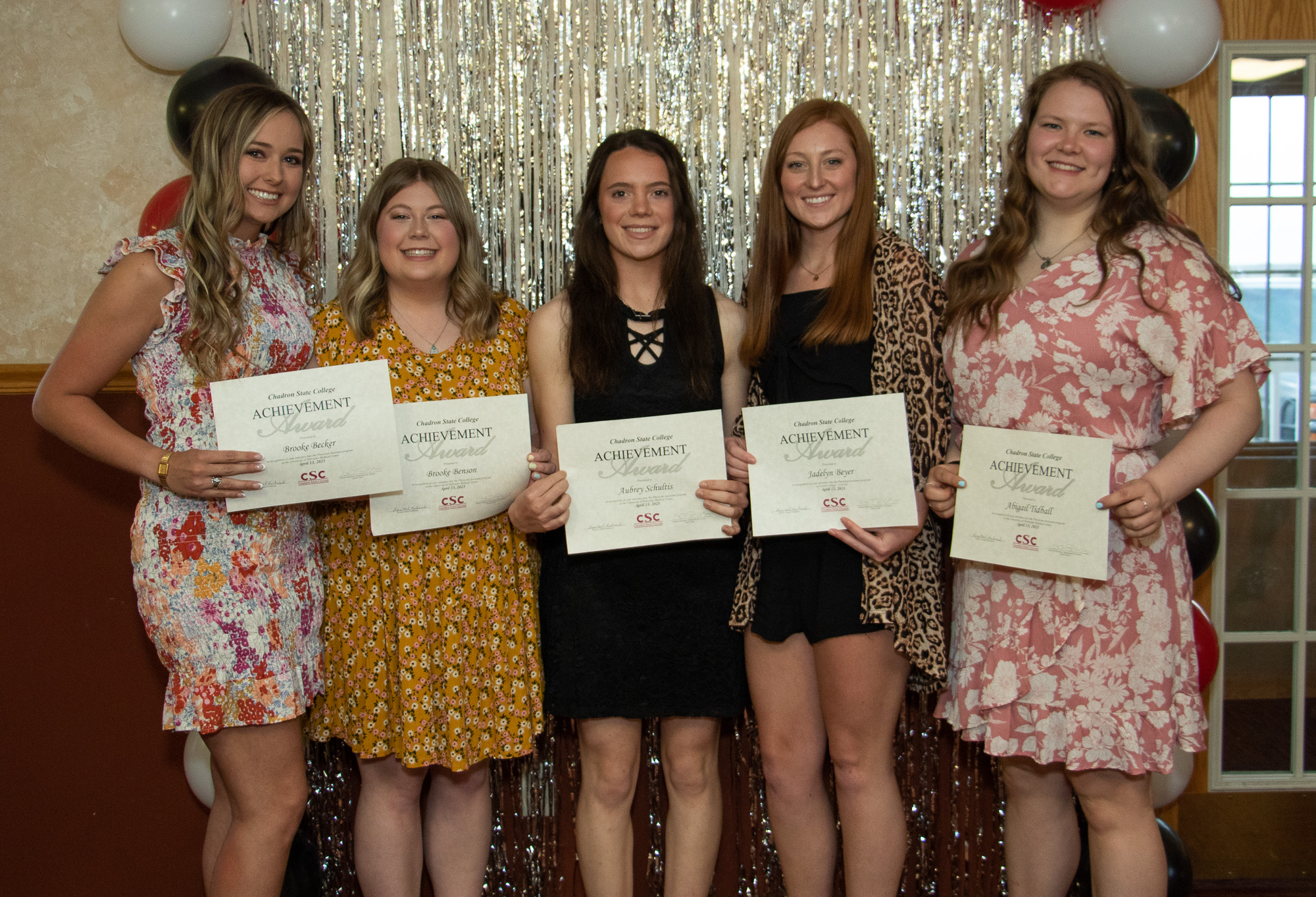 People standing with awards