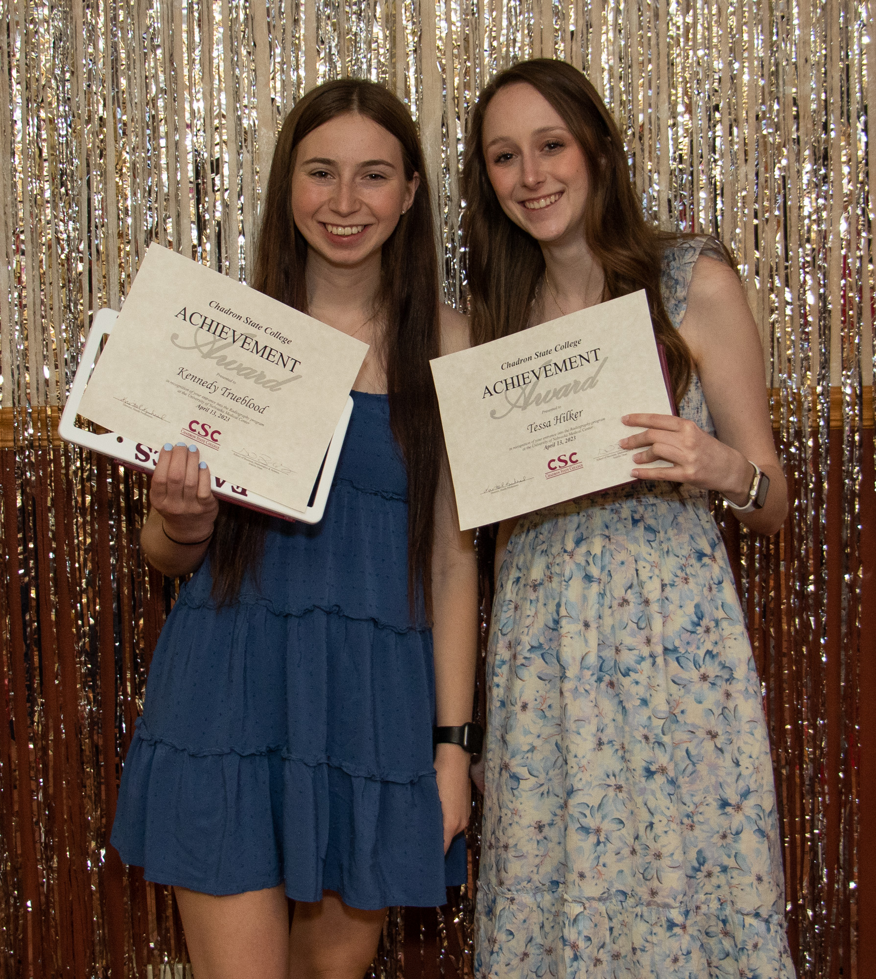 People standing with awards