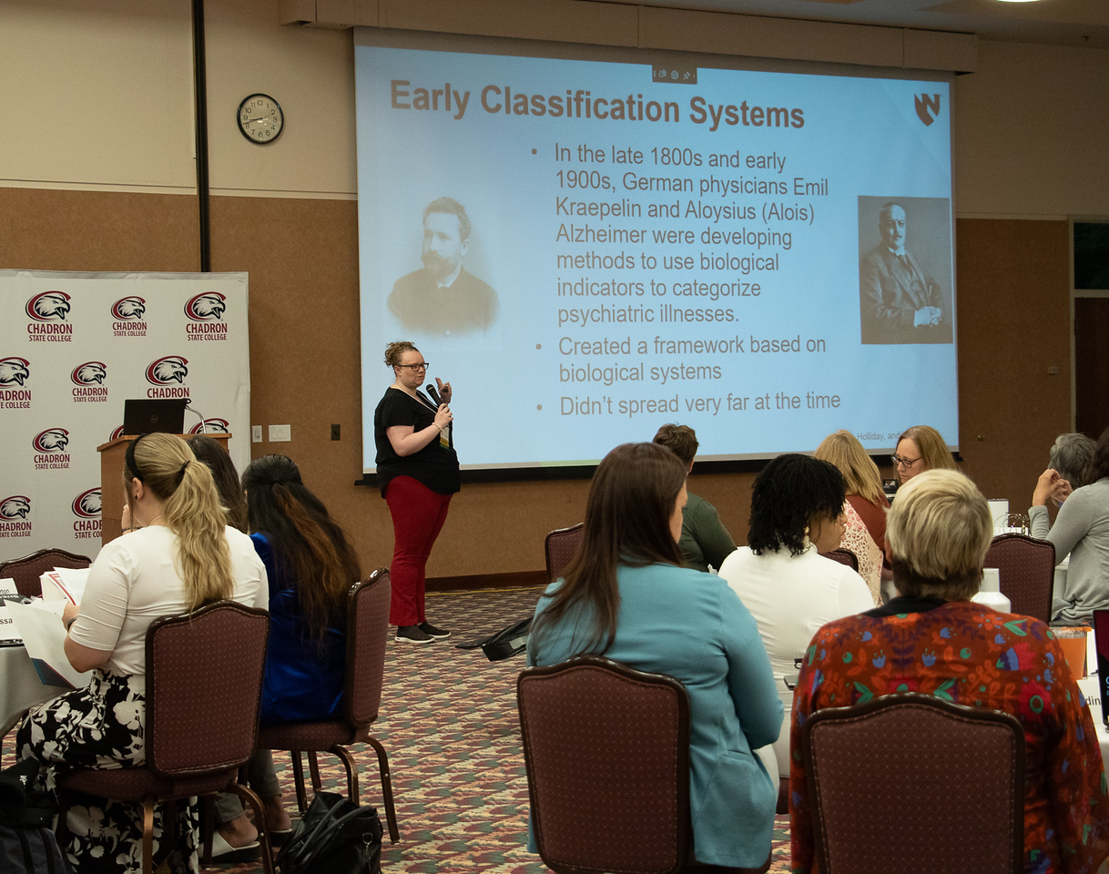 Woman speaking to an audience in the Student Center Ballroom