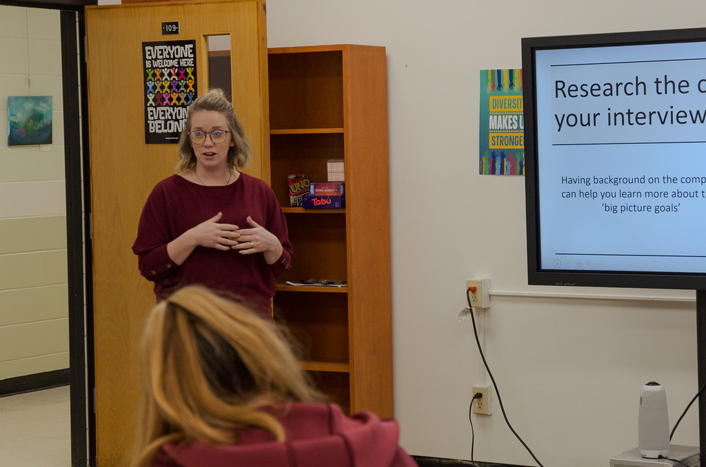 Woman instructing a small group of students