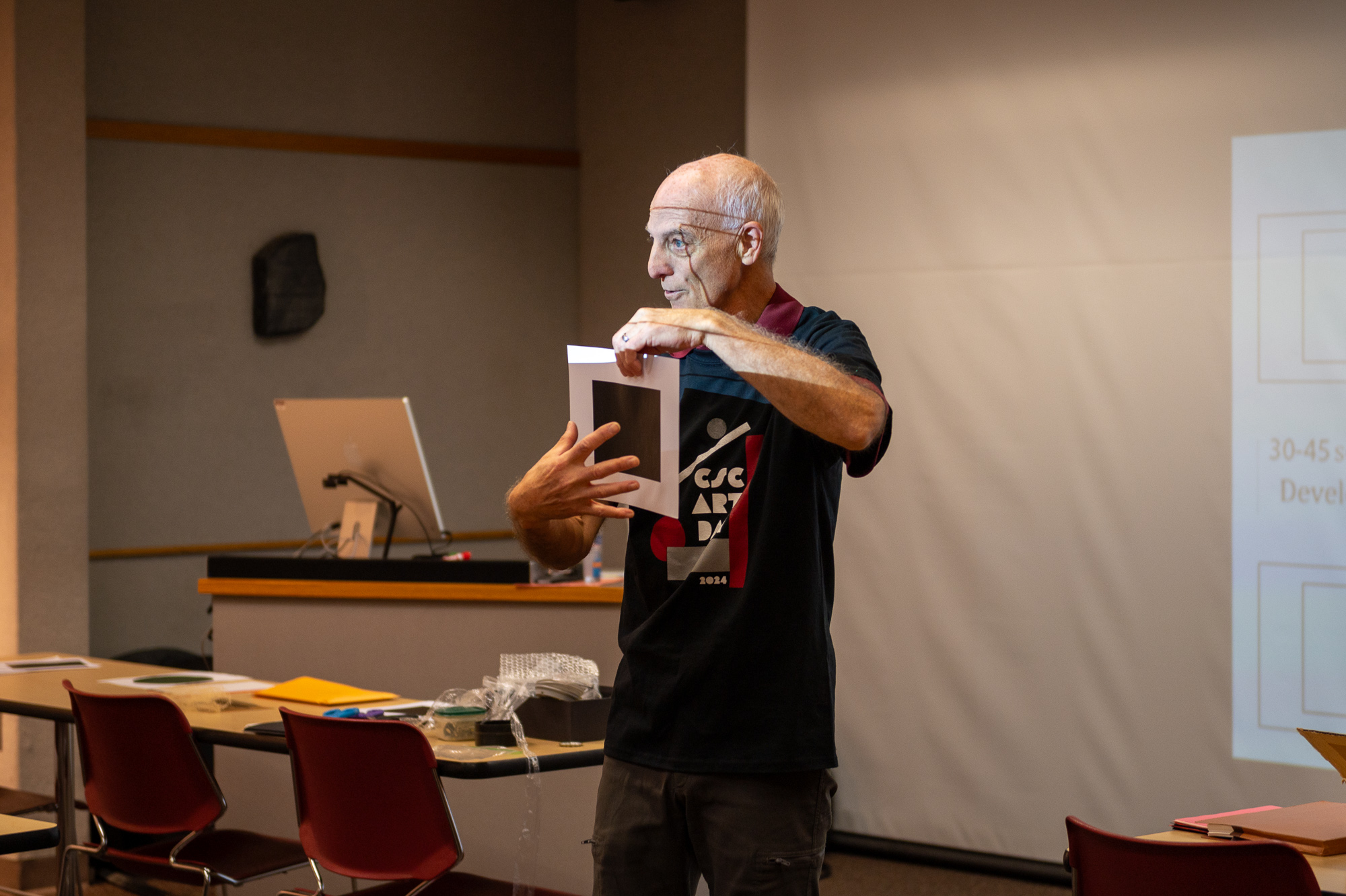 Adjunct Instructor Dewayne Gimeson demonstrates photograms during photography workshop at Art Day, Nov. 6, 2024. (Photo by Sydney Brown/Chadron State College)