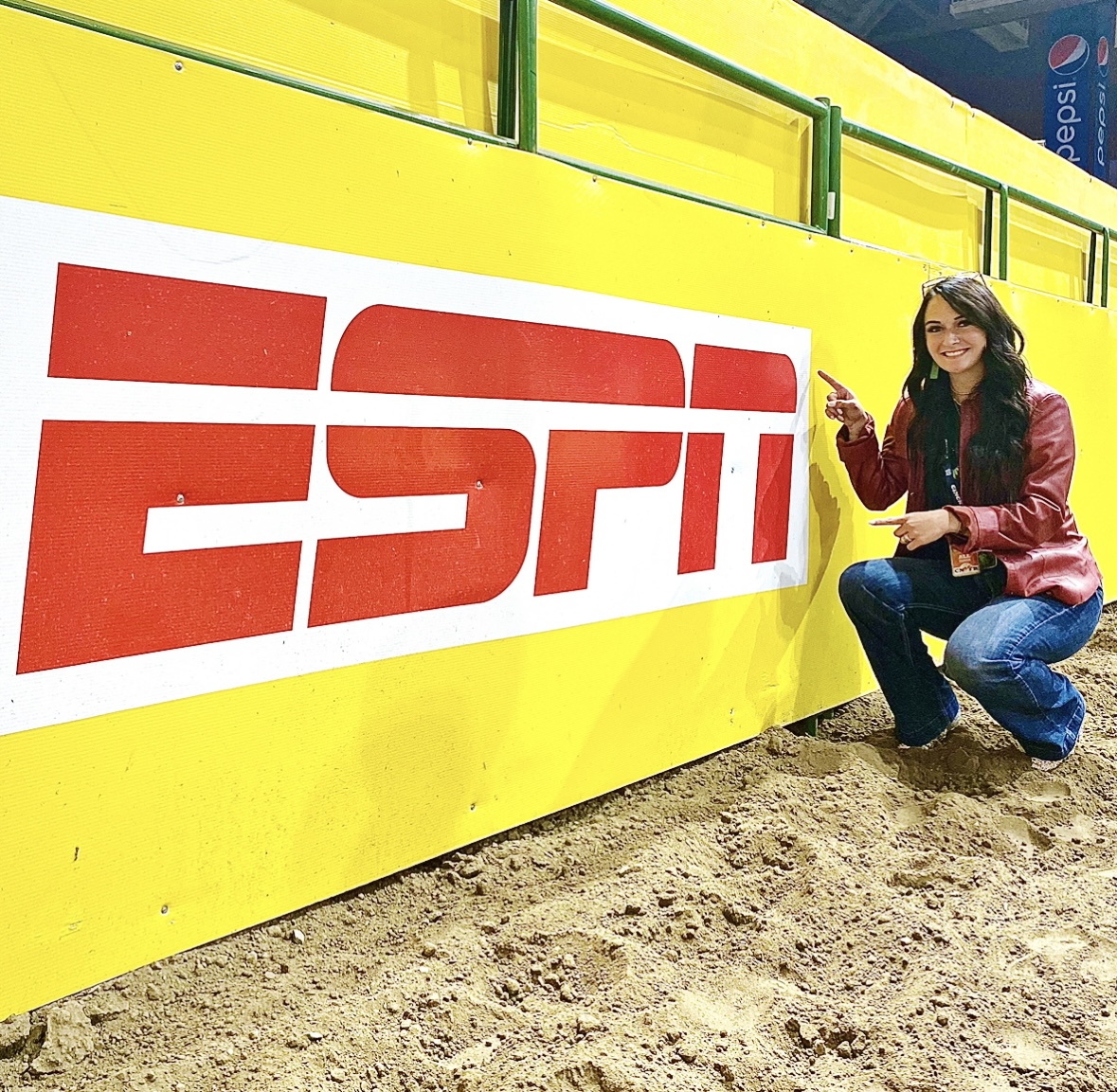 Woman posing in a rodeo arena