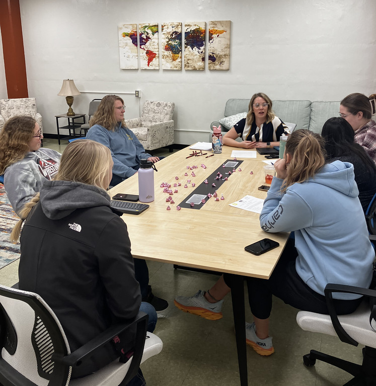 Woman instructing a small group of students
