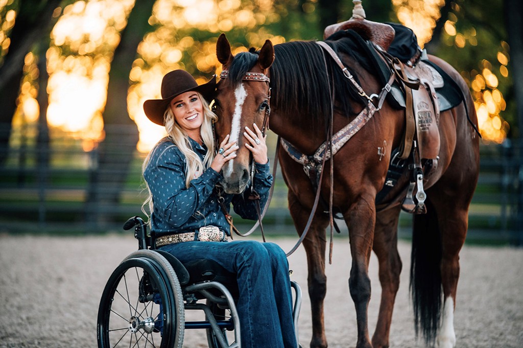 Woman in a wheelchair with a horse