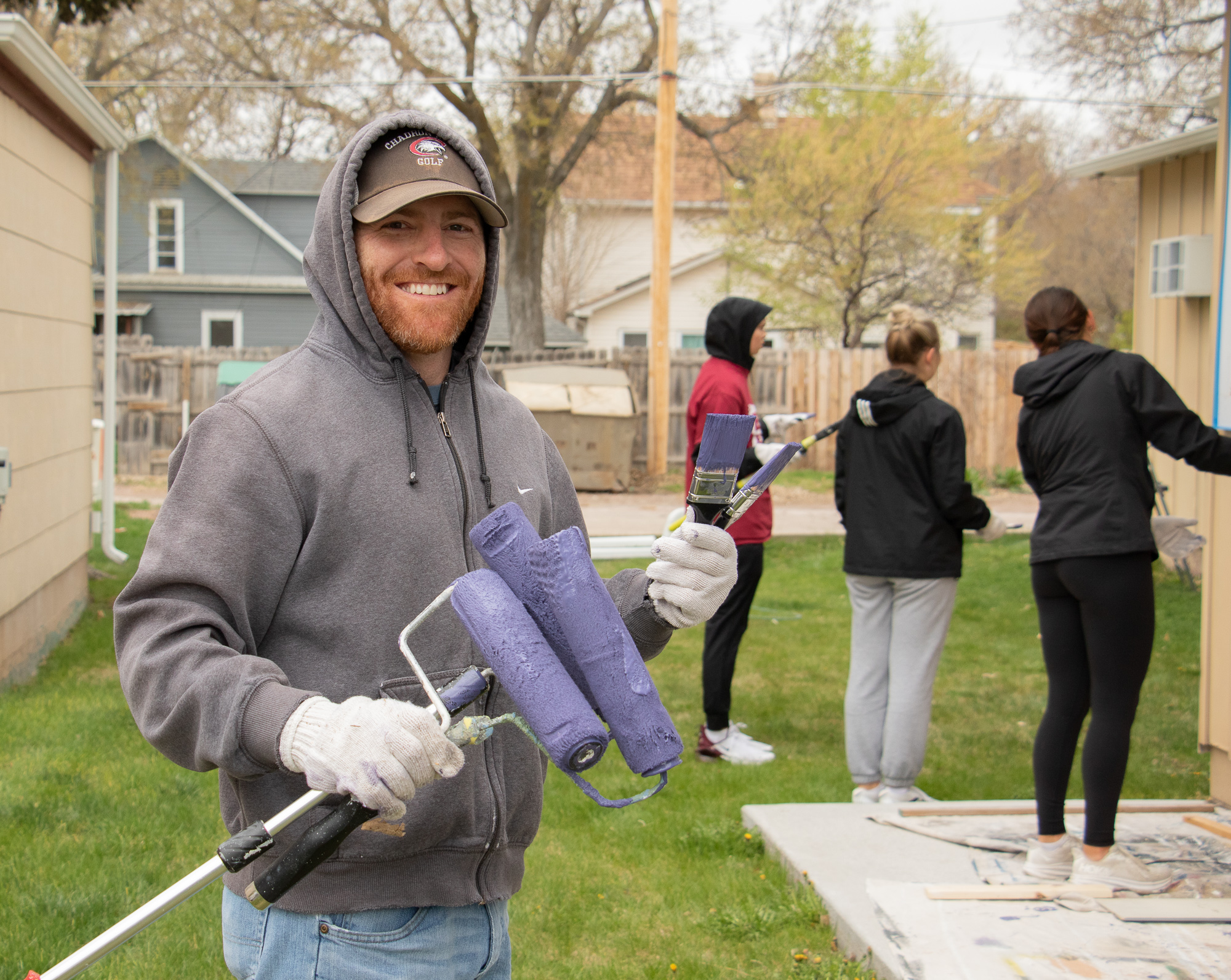 Male posing with paint rollers