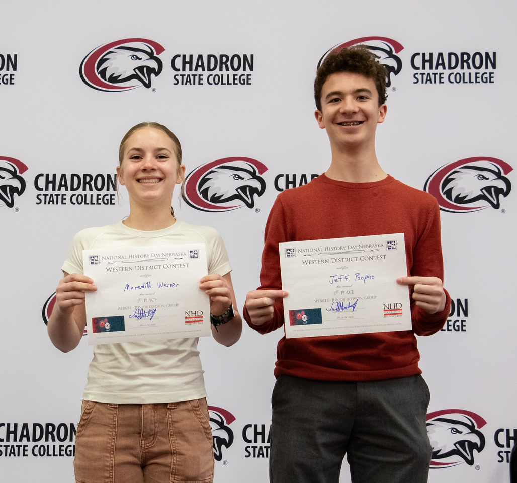 Students posing with certificates