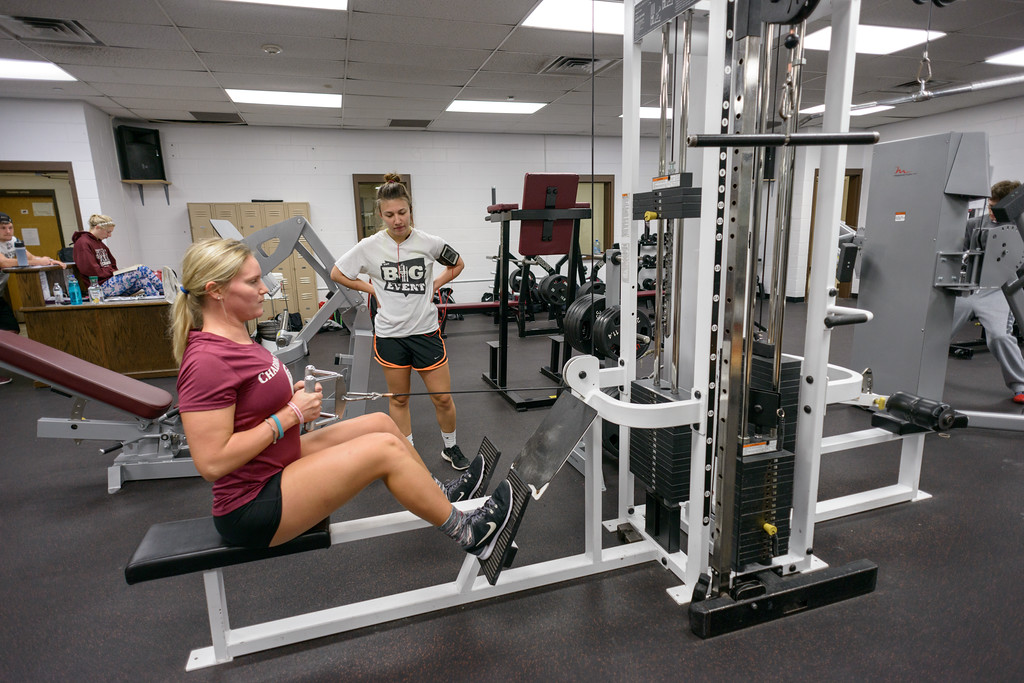 Student on weight machine