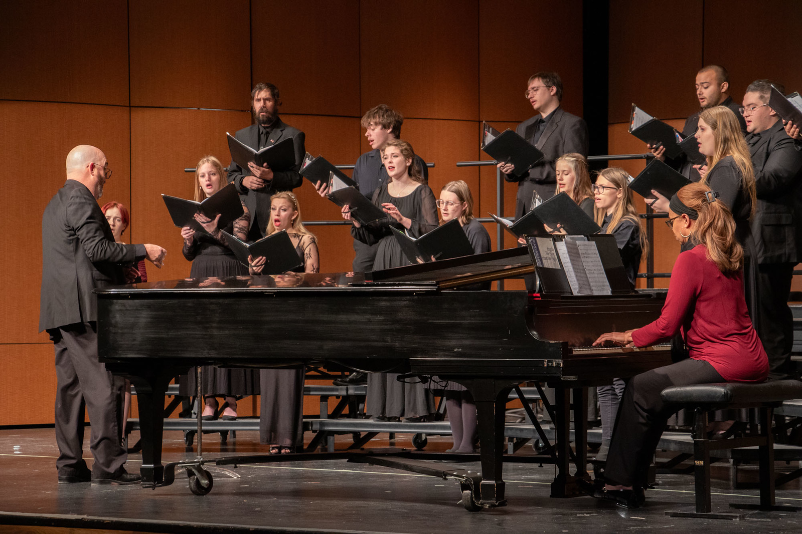A college choir performing on stage