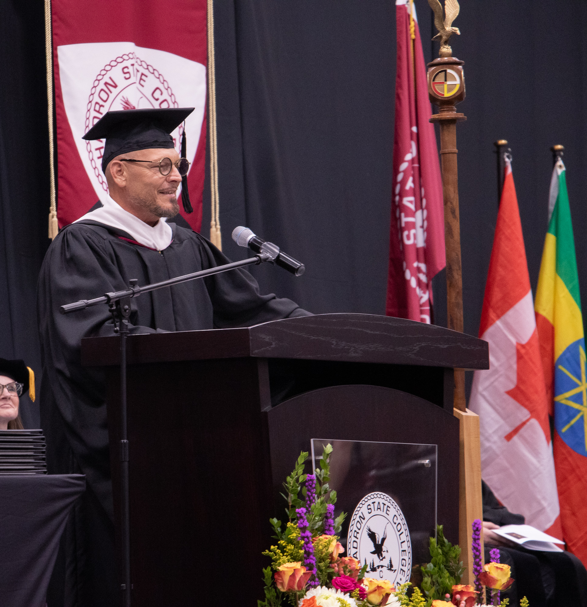 Male speaker at podium