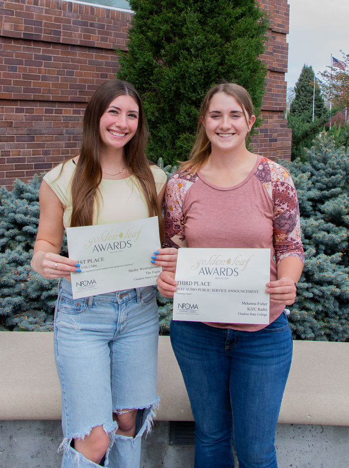 Two students posing outside