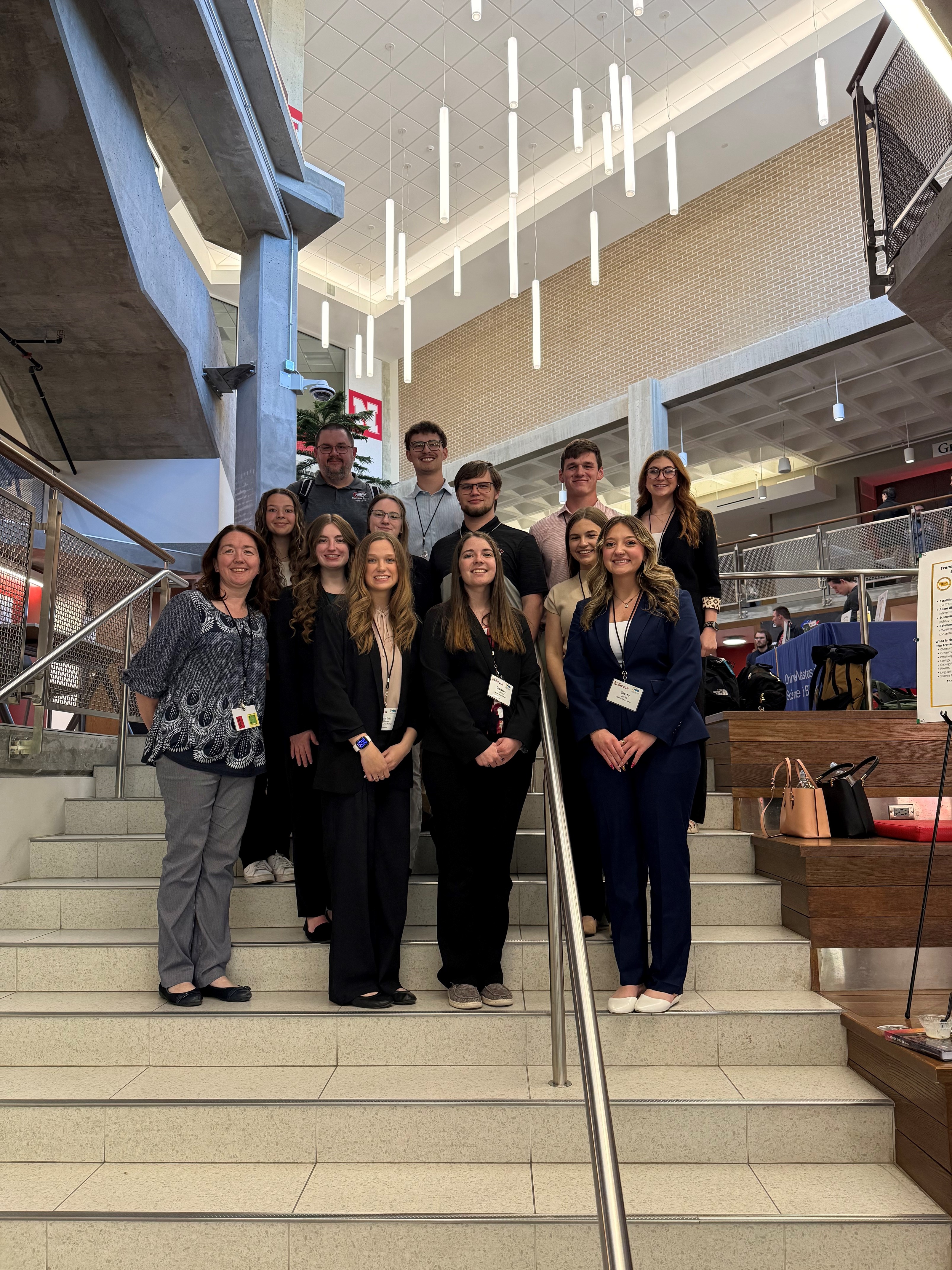 Group of students and faculty posing inside