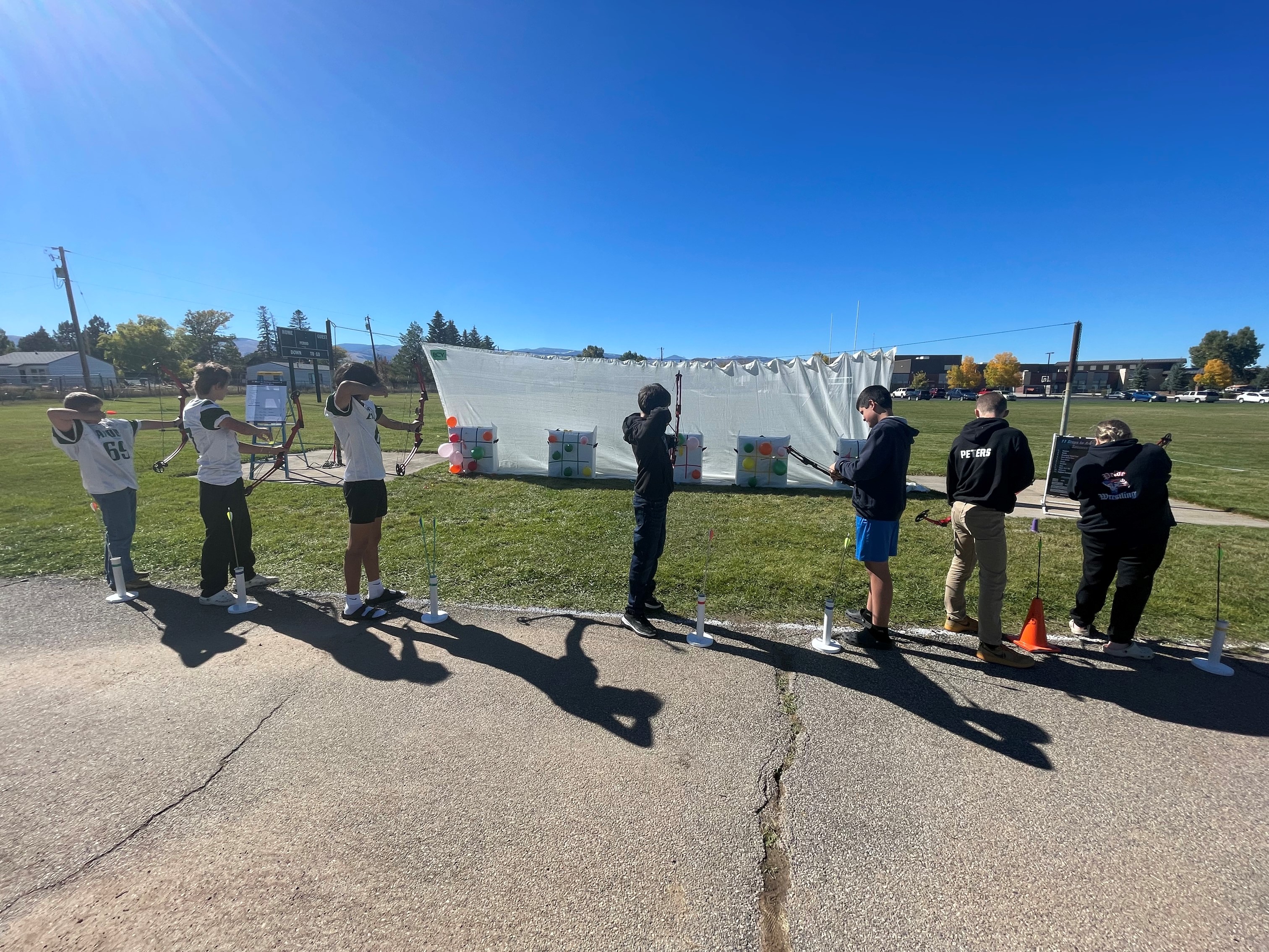 Archery students outside with targets