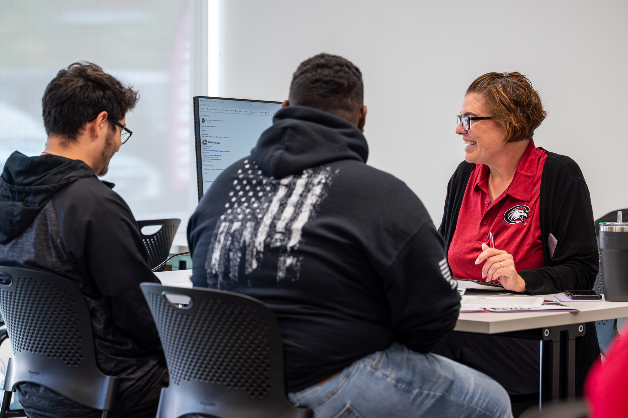 Students meeting with academic advisor