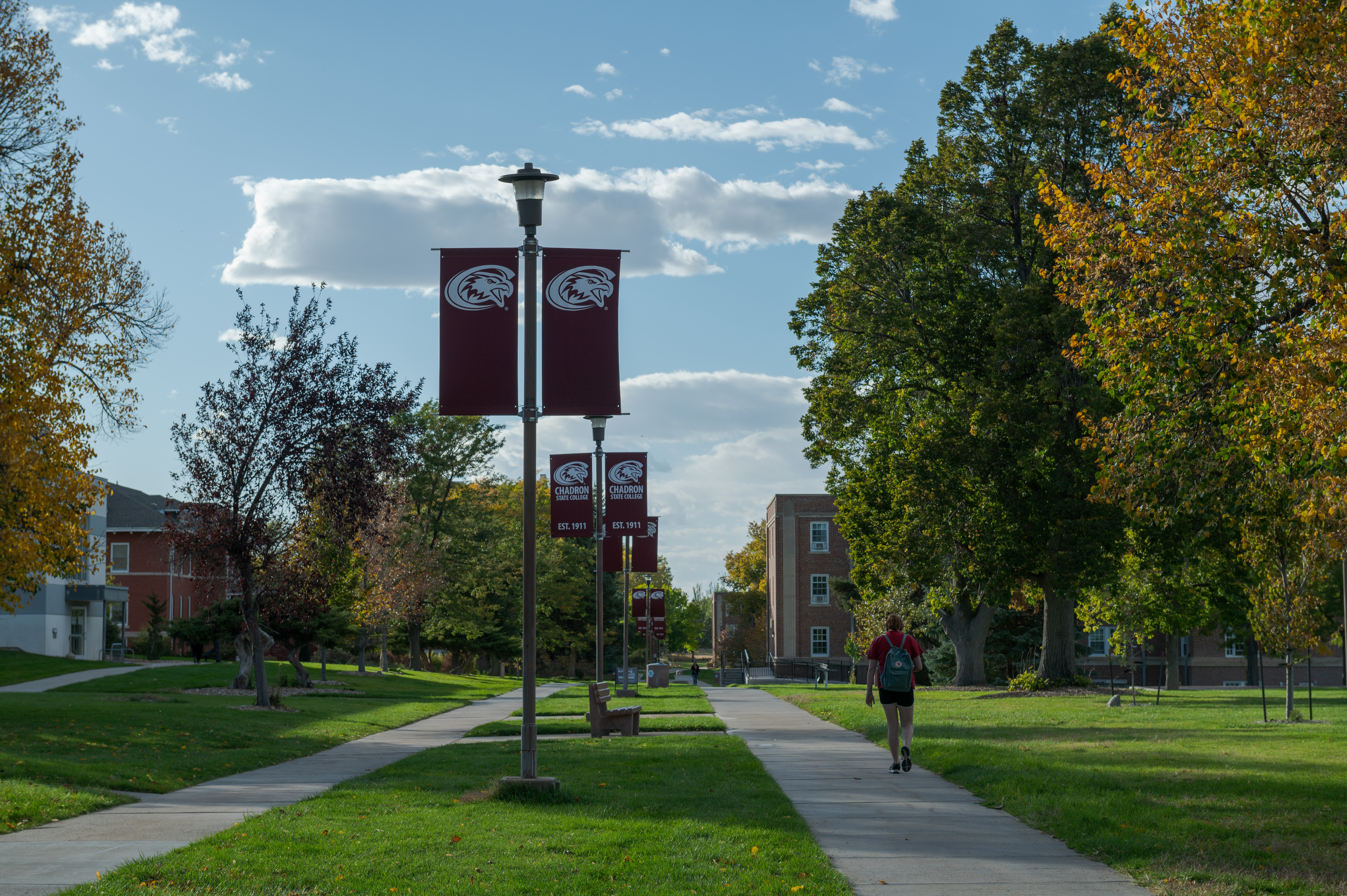 A student walking on campus.