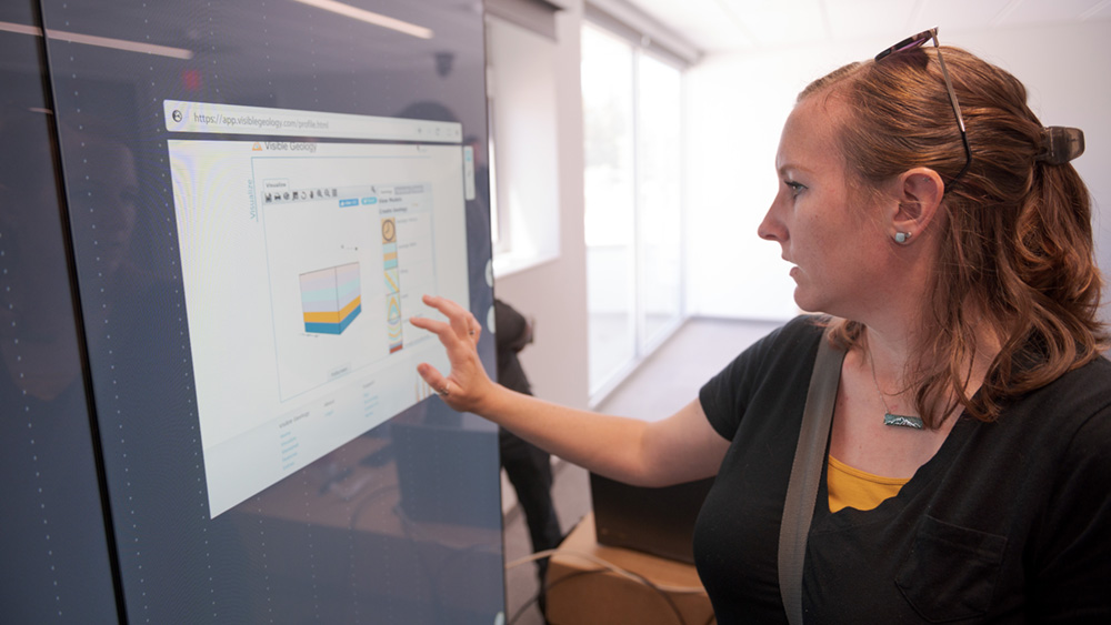 Dr. Tawny Tibbits works with an interactive display in the Math Science Center of Innovative Learning