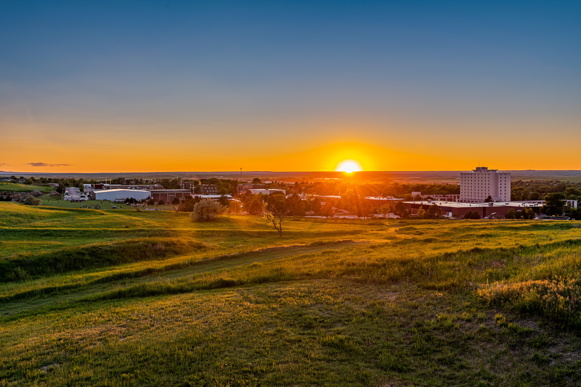 View of campus from the Rangeland building looking at the setting sun.